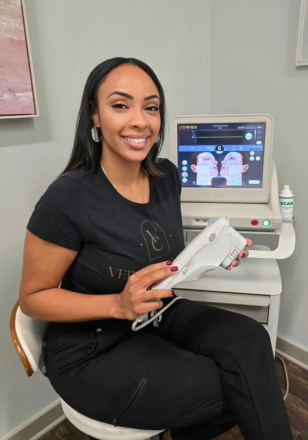 Vein & Cosmetic Center Esthetician holding Ultherapy device to lift, tone and tighten sagging skin