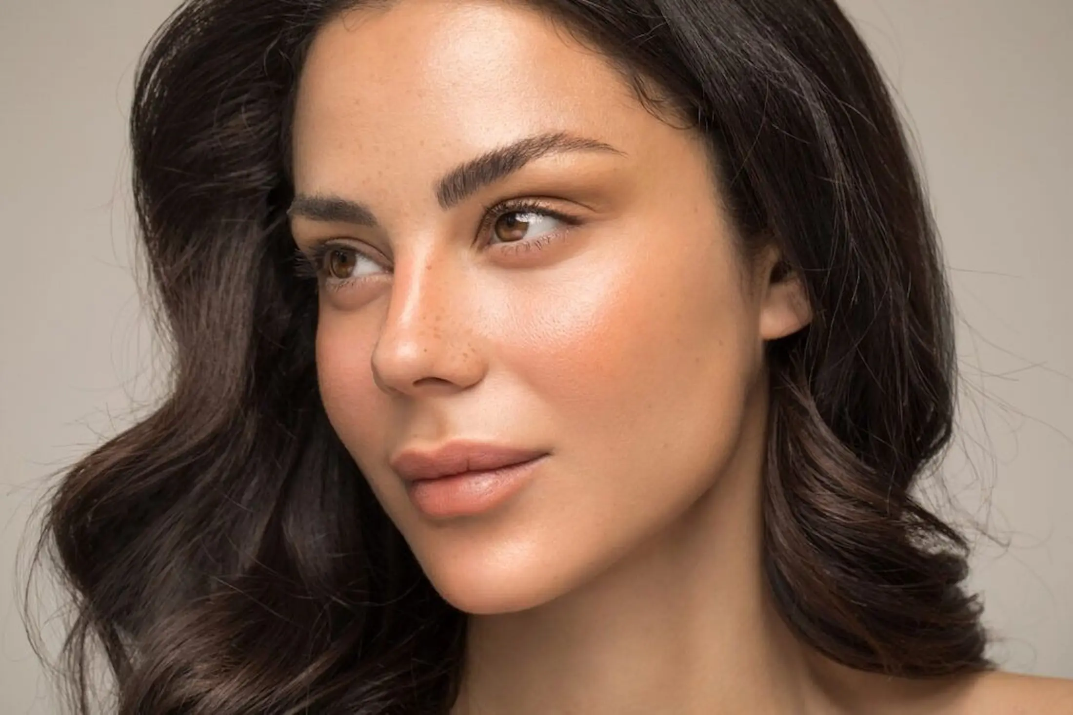 Woman with sculpted, defined jawline after filler enhancement in Tampa