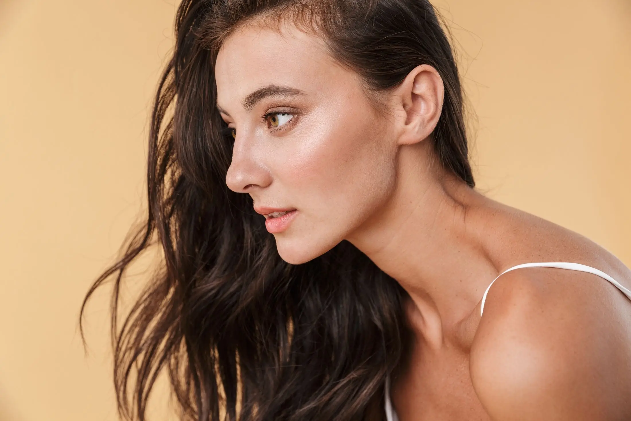 Woman with lifted, defined cheekbones after filler contouring in Tampa Bay