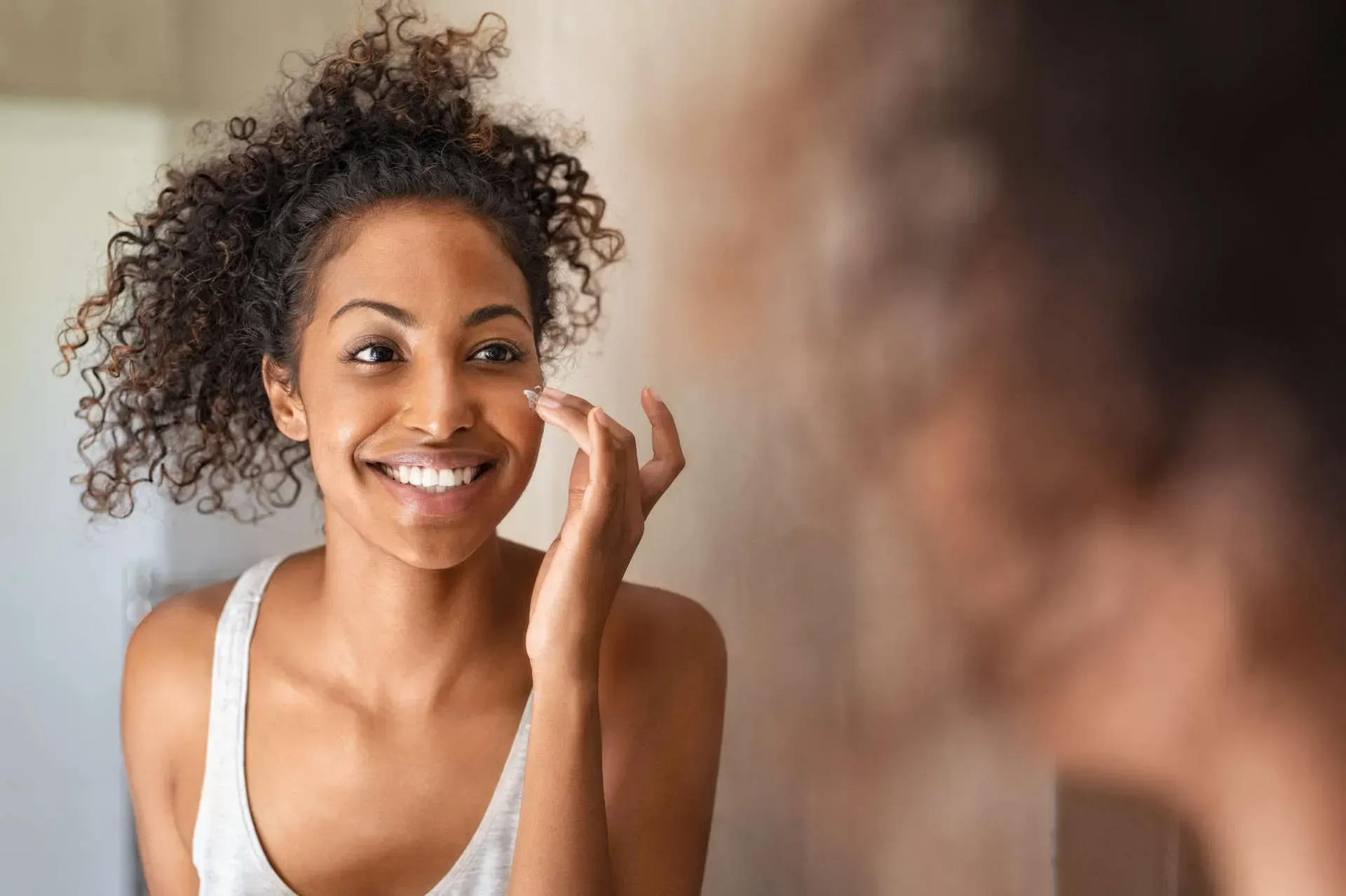 Woman with lifted, defined facial features after Radiesse filler in Tampa