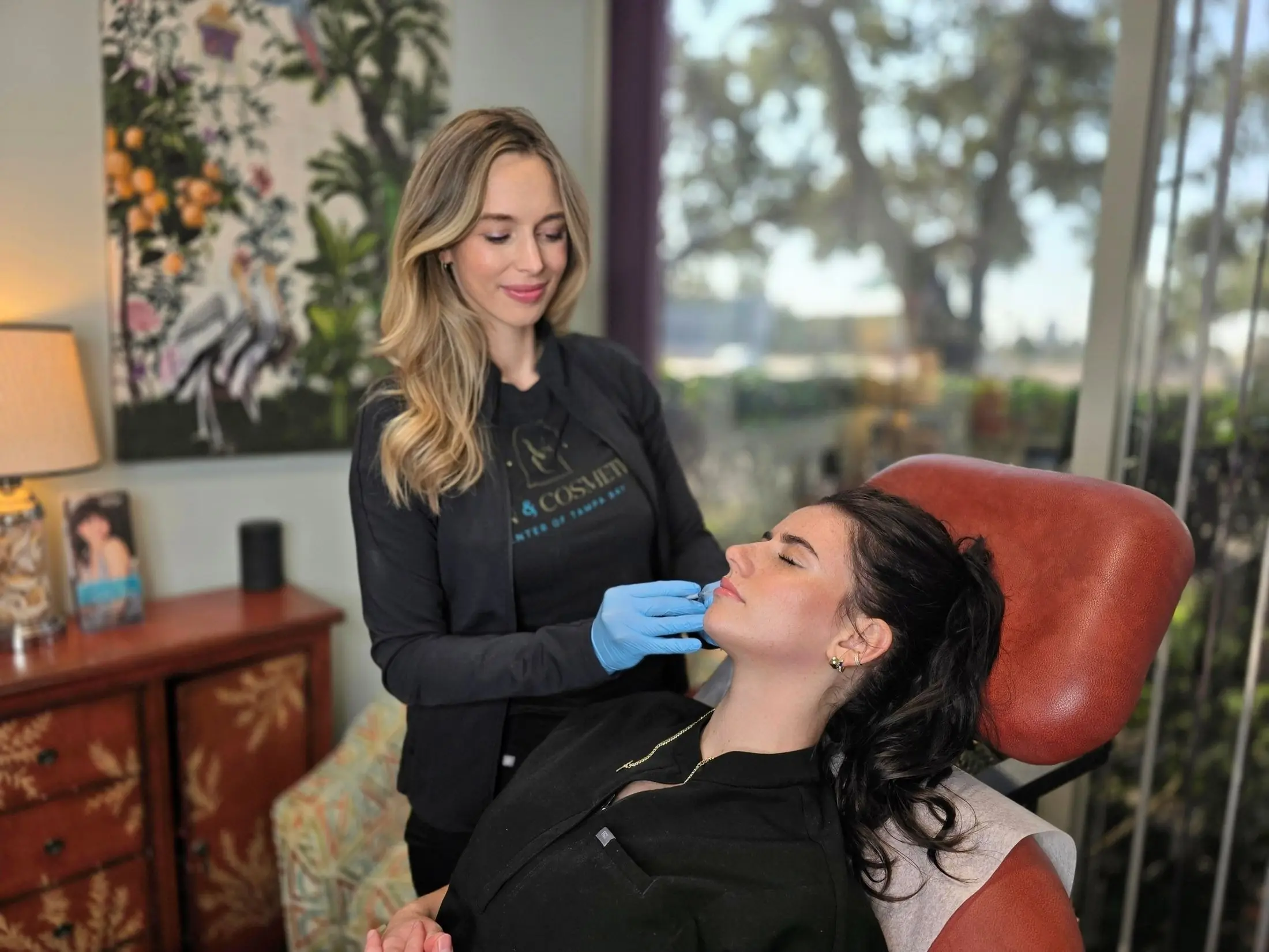 Provider using injectable filler to woman's lips