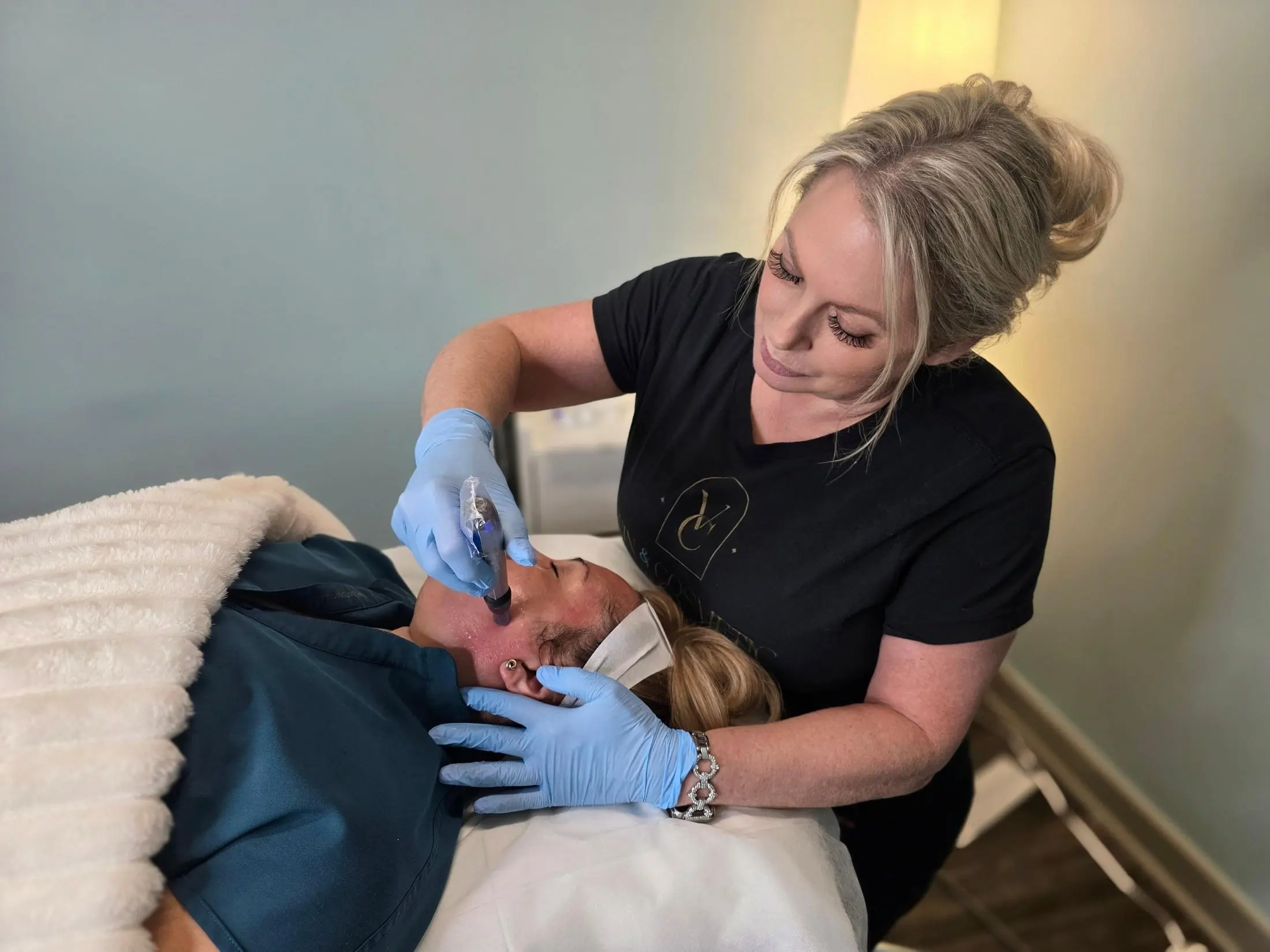 Woman receiving a microneedling skincare treatment