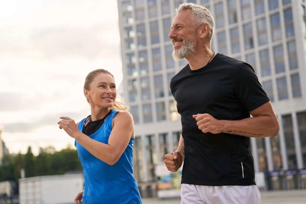 active senior couple jogging