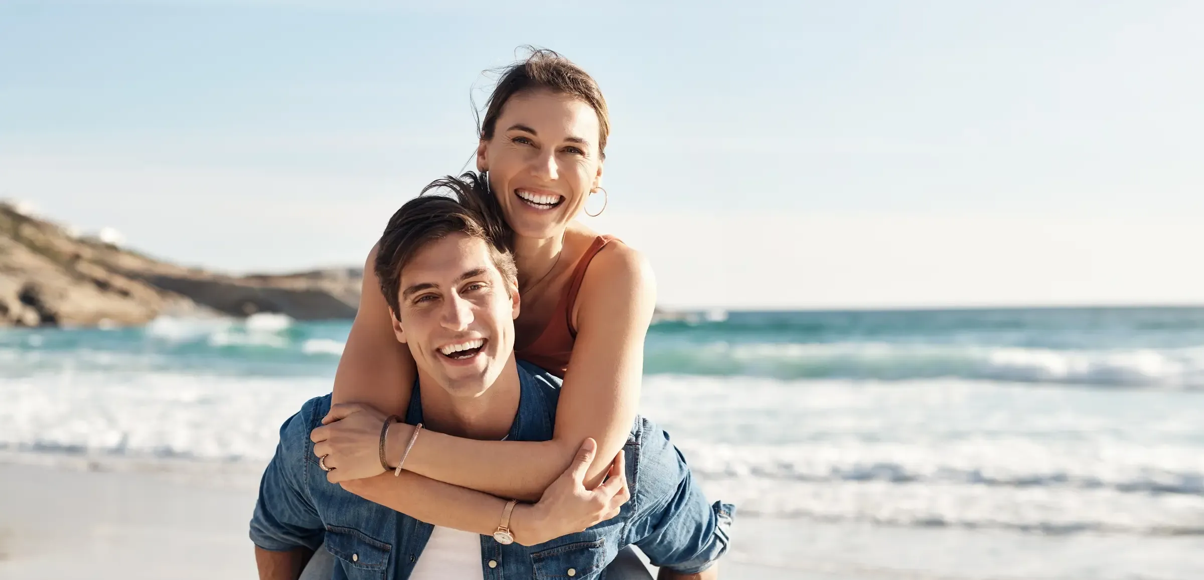 Couple enjoying a sunny beach day