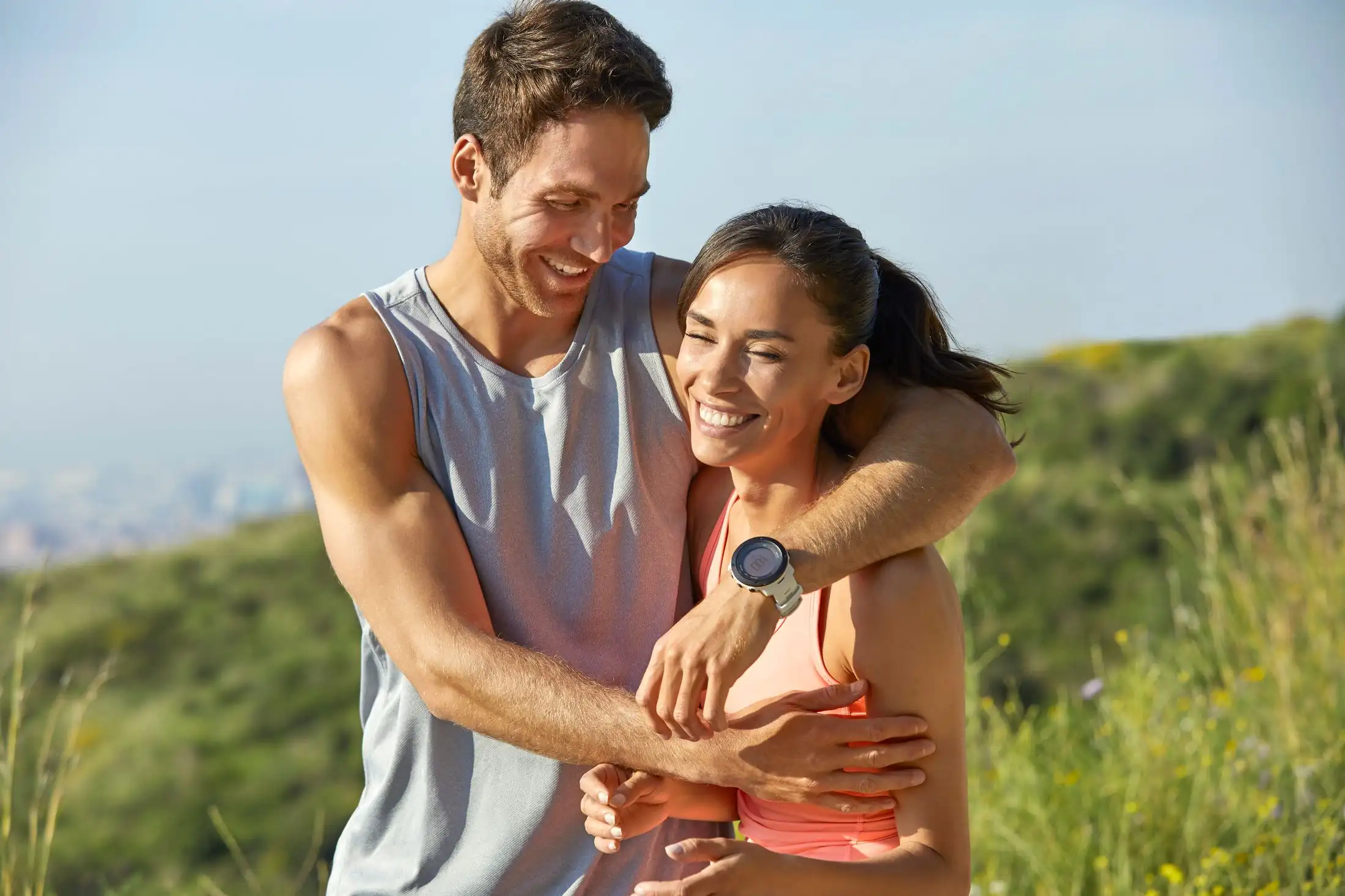 happy and healthy couple smiling on beach
