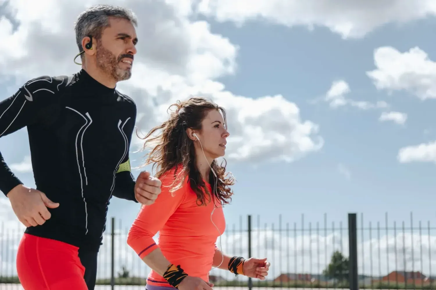Active man and woman jogging