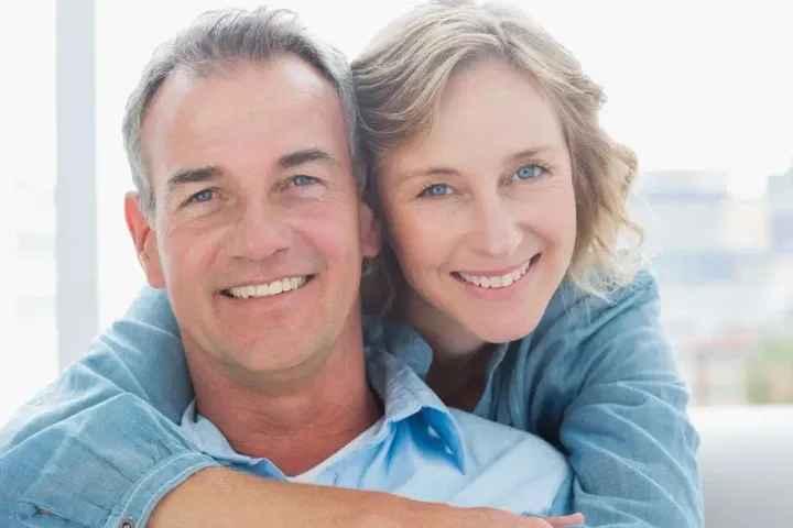 loving mature man and woman smiling together