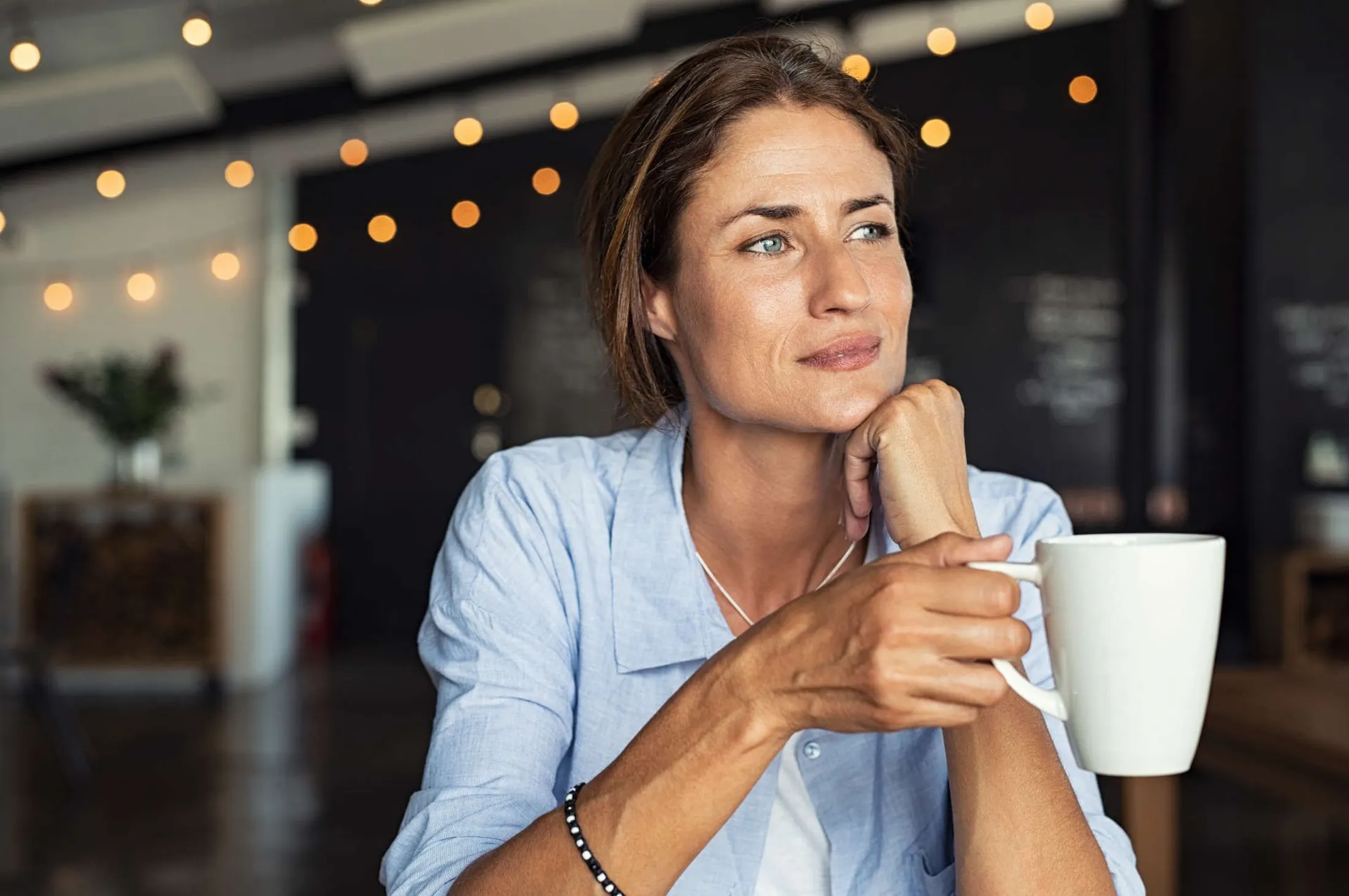 middle-aged woman thinking about skin treatments