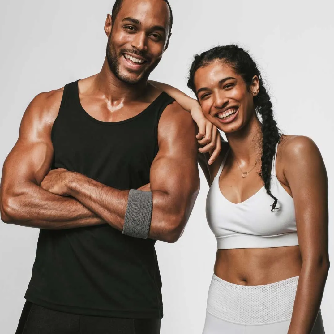 fit couple in athletic wear with sculpted figures
